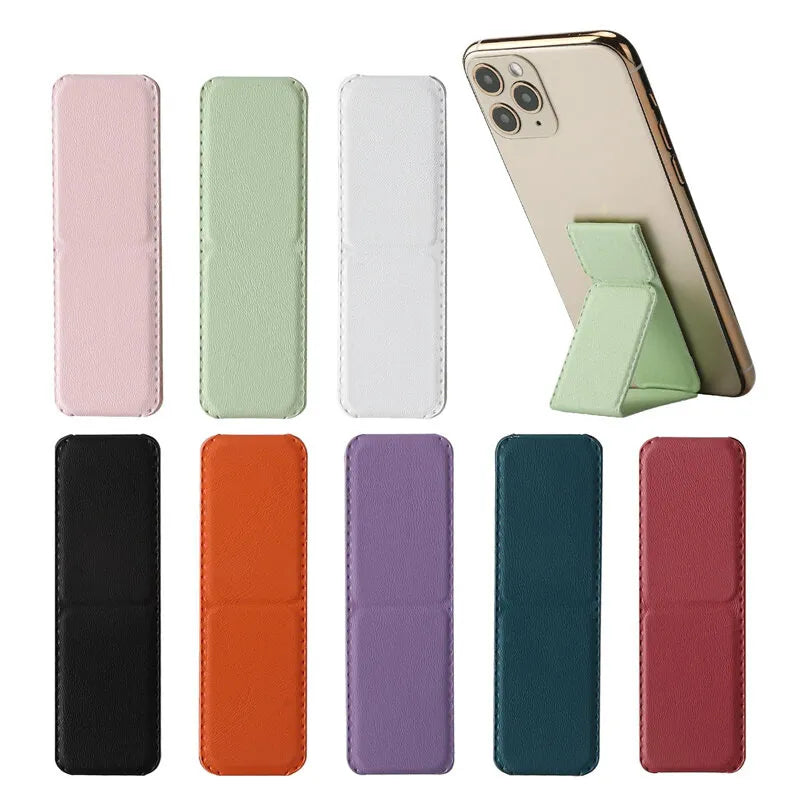 A set of leather-look phone wallet cases shown in multiple colors, with one case mounted on a smartphone to demonstrate its built-in kickstand feature. The cases are displayed in vertical rows against a plain white background.