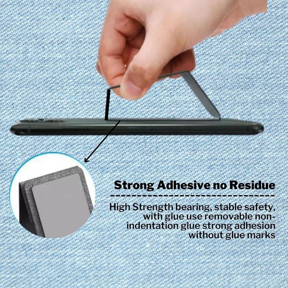 A hand holds a black adhesive strip against a blue textured fabric background, with text reading 'Strong Adhesive no Residue' and a circular inset showing the adhesive surface.