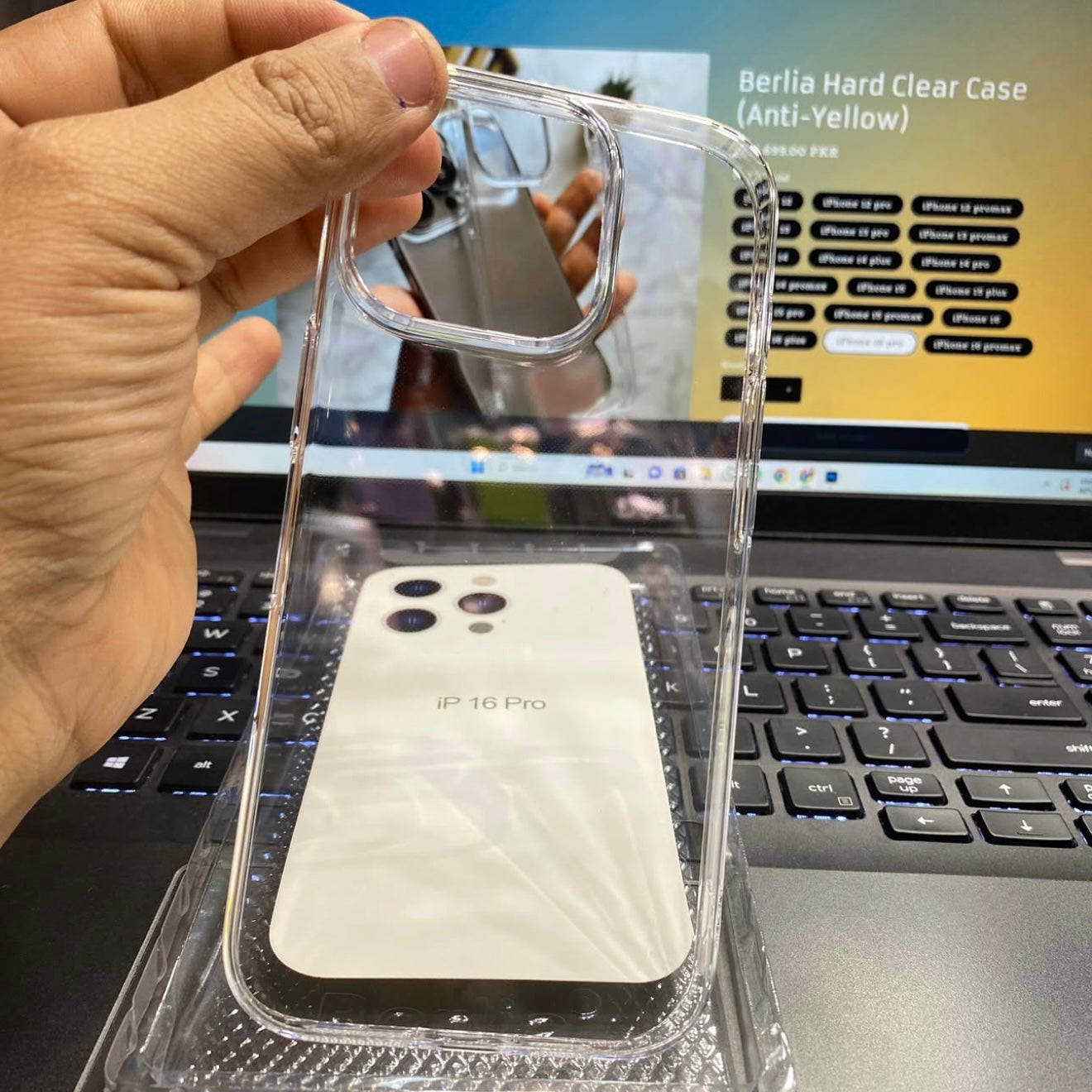 Close-up of the Original Berlia Crystal Clear iPhone Case showing raised camera protection, anti-yellow transparent finish, and precision cutouts.